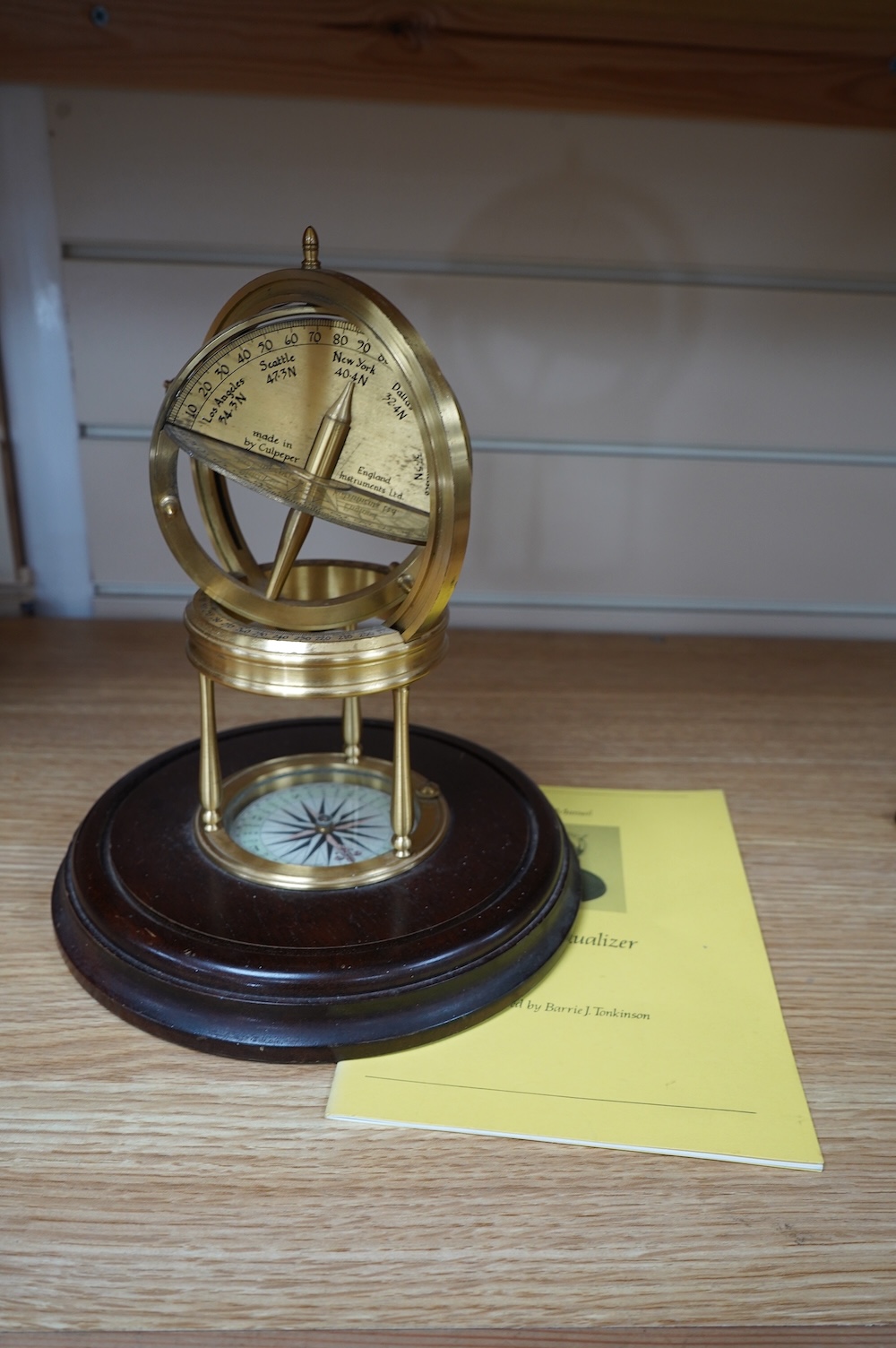 A reproduction brass Astro Visualizer designed by Barrie J Tonkinson and made in England by Culpepper Instruments Ltd., on a hardwood base, 24cm high, with user manual. Condition - fair to good.